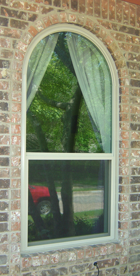 Vinyl Replacment Windows Dallas Texas.  This window installation included a full wrap of exterior wood with aluminum coil stock custom bent to produce the dimensional wood window look on the exterior while still producing a window that requires no painting