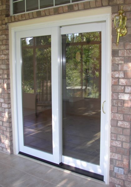 Wood sliding doors with aluminum clad exteriors
