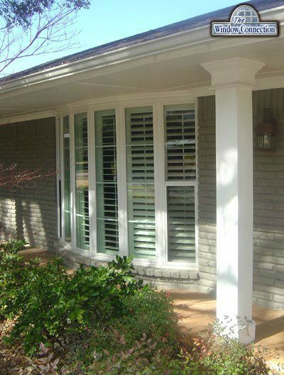 Six LIte Mezzo Bow Window From Alside in Dallas Texas.  Picture windows with single hung flankers and shutters and grids.
